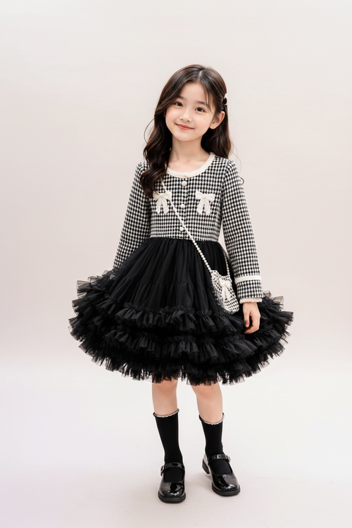 Girl in houndstooth tulle dress - pastel studio background